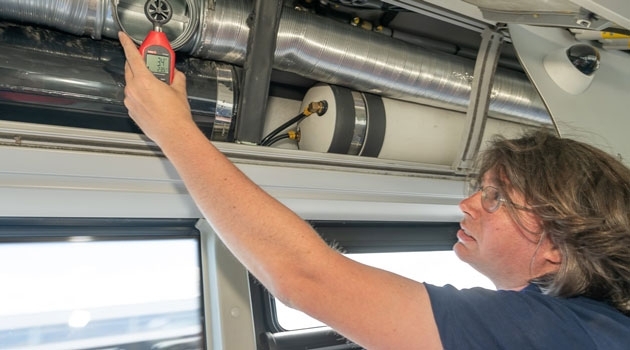 Marvin Seibert is measuring the airflow on newly installed, ten meters long air extraction ducts on a 70 passenger hybrid-electric city bus. Photo: