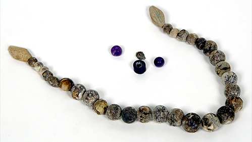 Necklace of glass and stone beads.