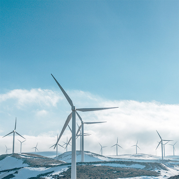 Wind turbines on a snow covered mountain