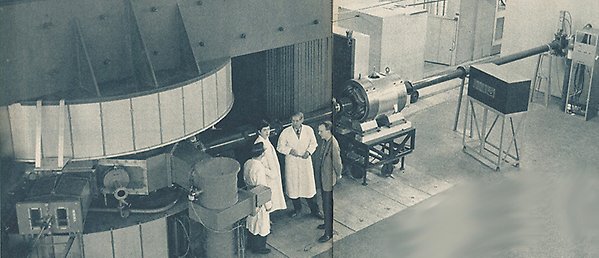 Old picture of the cyclotron with personnel in front of it. Source: TSL internt