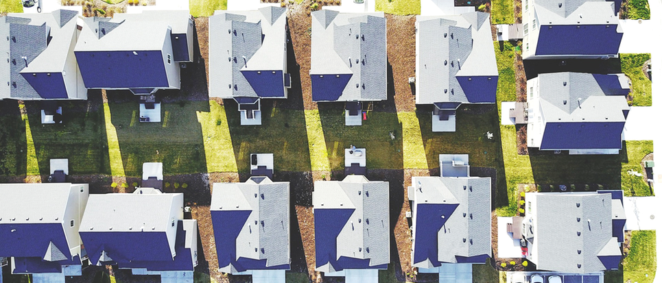 Aerial view of detached new built houses in a suburb.