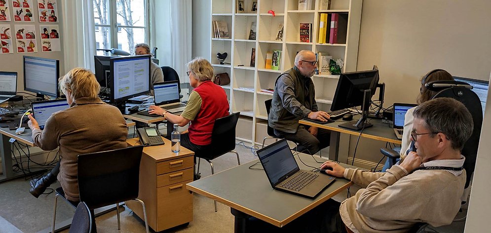 Researchers work at their computers